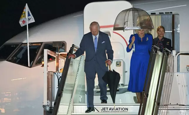 Britain's King Charles and Queen Camilla arrive in Sydney for the start of a five-day tour to Australia, Friday, Oct. 18, 2024. (Dean Lewins/AAP Image via AP)