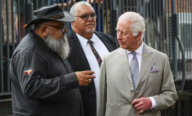 Britain's King Charles III, right, visits the National Centre of Indigenous Excellence on Tuesday Oct. 22, 2024 in Sydney, Australia. (Lisa Maree Williams/Pool Photo via AP)