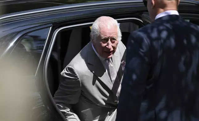 King Charles III exits a car as he arrives for a visit with Queen Camilla to St Thomas' Anglican Church in Sydney, Sunday, Oct. 20, 2024. (Dean Lewins/Pool Photo via AP)