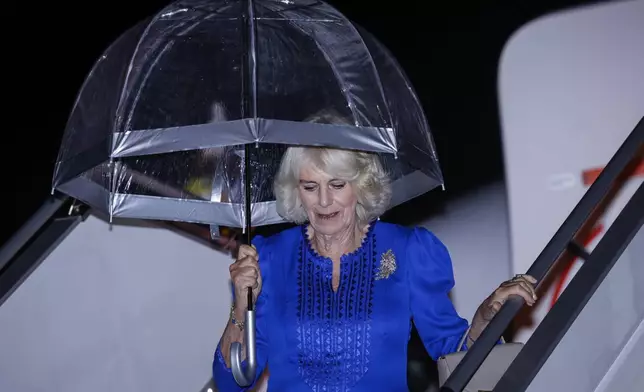 Britain's Queen Camilla arrives in Sydney for the start of a five day tour to Australia, Friday, Oct. 18, 2024. (Brook Mitchell/Pool Photo via AP)