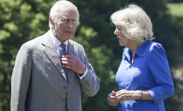 Britain's King Charles III, left, and Queen Camilla arrives to attend the Premier's Community BBQ on Tuesday Oct. 22, 2024 in Sydney, Australia. (Brook Mitchell/Pool Photo via AP)