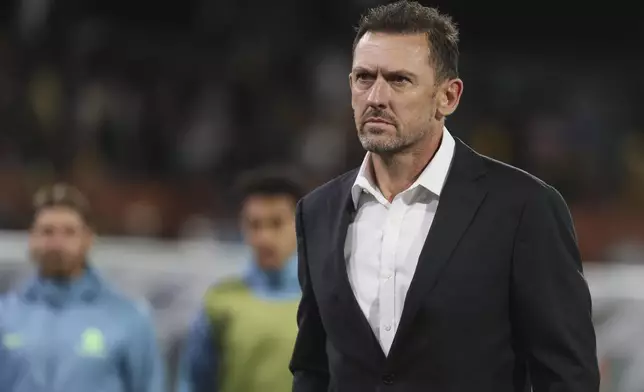 Australia's coach Tony Popovic walks from the field at halftime during the World Cup 2026 Group C qualifying soccer match between Australia and China at Adelaide Oval, Adelaide, Australia, Thursday Oct. 10, 2024. (AP Photo/James Elsby)