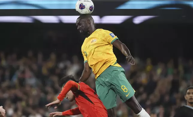 Australia's Jason Geria heads the ball during the World Cup 2026 Group C qualifying soccer match between Australia and China at Adelaide Oval, Adelaide, Australia, Thursday Oct. 10, 2024. (AP Photo/James Elsby)