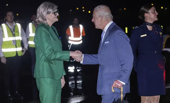 Britain's King Charles meets Ms Sam Mostyn, Governor-General of Australia, on his arrival in Sydney for the start of a five-day tour to Australia, Friday, Oct. 18, 2024. (Brook Mitchell/Pool Photo via AP)