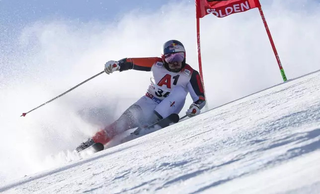 Netherland's Marcel Hirscher speeds down the course during an alpine ski, men's World Cup giant slalom, in Soelden, Austria, Sunday, Oct. 27, 2024. (AP Photo/Marco Trovati)