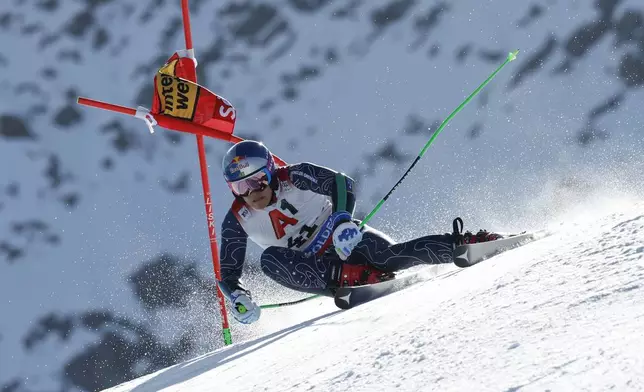 Brazil's Lucas Pinheiro Braathen speeds down the course during an alpine ski, men's World Cup giant slalom, in Soelden, Austria, Sunday, Oct. 27, 2024. (AP Photo/Alessandro Trovati)