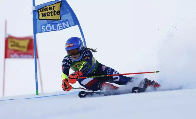 United States' Mikaela Shiffrin speeds down the course during an alpine ski, women's World Cup giant slalom, in Soelden, Austria, Saturday, Oct. 26, 2024. (AP Photo/Alessandro Trovati)