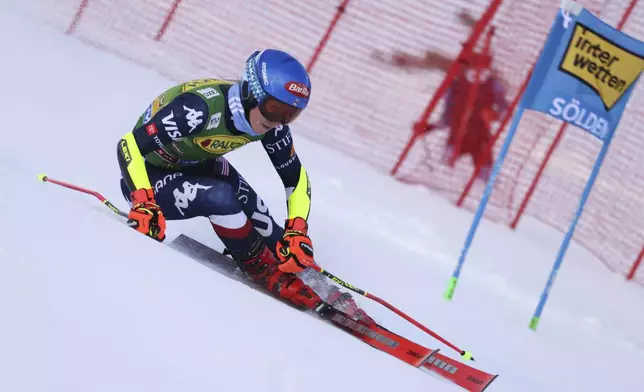 United States' Mikaela Shiffrin speeds down the course during an alpine ski, women's World Cup giant slalom, in Soelden, Austria, Saturday, Oct. 26, 2024. (AP Photo/Marco Trovati)