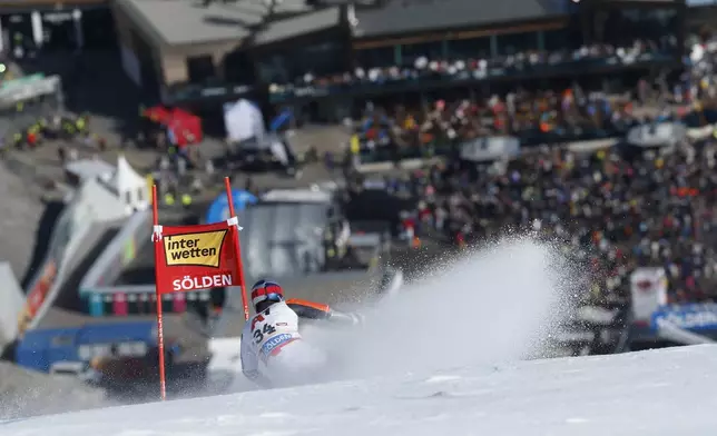 Netherland's Marcel Hirscher speeds down the course during an alpine ski, men's World Cup giant slalom, in Soelden, Austria, Sunday, Oct. 27, 2024. (AP Photo/Alessandro Trovati)