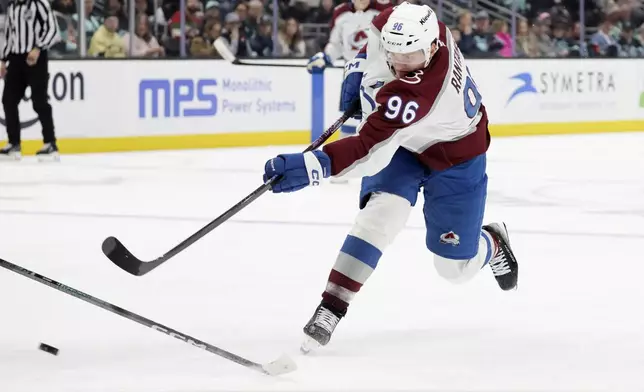 Colorado Avalanche right wing Mikko Rantanen shoots on goal but is blocked against the Seattle Kraken during the second period of an NHL hockey game, Tuesday, Oct. 22, 2024, in Seattle. The Avalanche won 3-2. (AP Photo/John Froschauer)