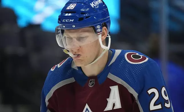 FILE - Colorado Avalanche center Nathan MacKinnon waits for play to resume in the second period of an NHL hockey game Tuesday, March 26, 2024, in Denver. (AP Photo/David Zalubowski, File)