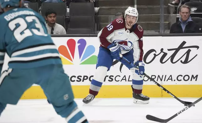 Colorado Avalanche defenseman Samuel Girard (49) looks to make a pass during the second period of an NHL hockey game in San Jose, Calif., Sunday, Oct. 20, 2024. (AP Photo/Minh Connors)