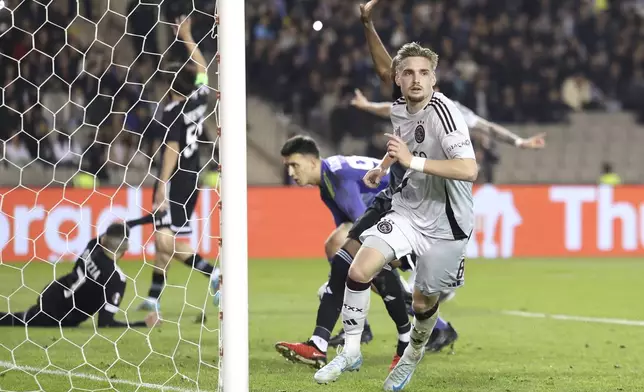 Ajax's Kenneth Taylor celebrates after scoring his side's opening goal during the Europa League soccer match between Qarabag and Ajax at the Tofiq Bahramov Republican stadium in Baku, Azerbaijan, Thursday, Oct. 24, 2024. (AP Photo)