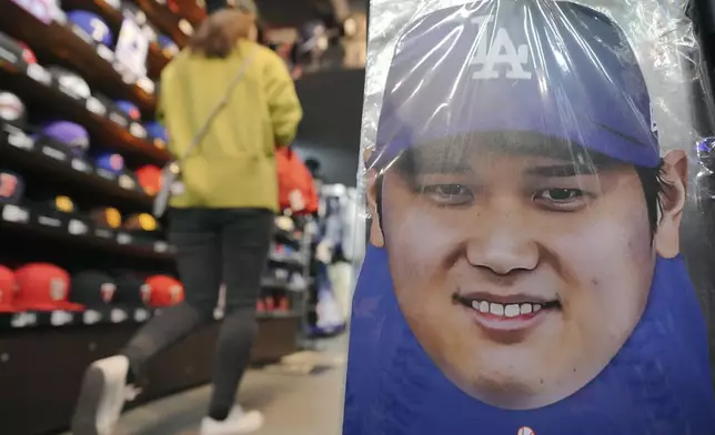 Goods related to Shohei Ohtani of the Los Angeles Dodgers are displayed at a sporting goods store, "SELECTION," in Shinjuku district Wednesday, Oct. 23, 2024 in Tokyo. (AP Photo/Eugene Hoshiko)