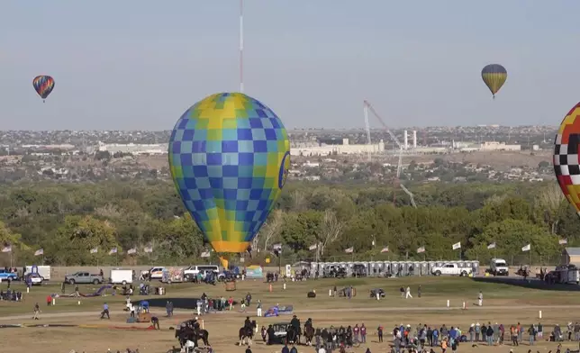 This image made from a video provided by Curt Fargo shows a radio tower collapsing after a hot-air balloon struck it during the famous festival in Albuquerque, N.M., Oct. 11, 2024. (Curt Fargo via AP)