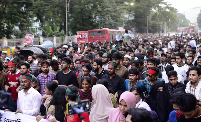 Protesters gather to demand the resignation of President Mohammed Shahabuddin after his comments that he had no documents proving that former Prime Minister Sheikh Hasina had resigned before fleeing the country, in Dhaka, Bangladesh, Tuesday, Oct. 22, 2024. (AP Photo/Mahmud Hossain Opu)