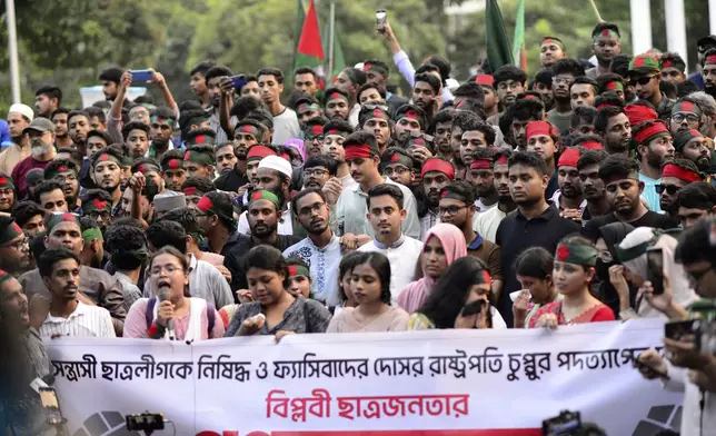 Protesters gather to demand the resignation of President Mohammed Shahabuddin after his comments that he had no documents proving that former Prime Minister Sheikh Hasina had resigned before fleeing the country, in Dhaka, Bangladesh, Tuesday, Oct. 22, 2024. (AP Photo/Mahmud Hossain Opu)