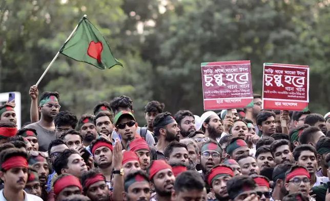 Protesters gather to demand the resignation of President Mohammed Shahabuddin after his comments that he had no documents proving that former Prime Minister Sheikh Hasina had resigned before fleeing the country, in Dhaka, Bangladesh, Tuesday, Oct. 22, 2024. (AP Photo/Mahmud Hossain Opu)