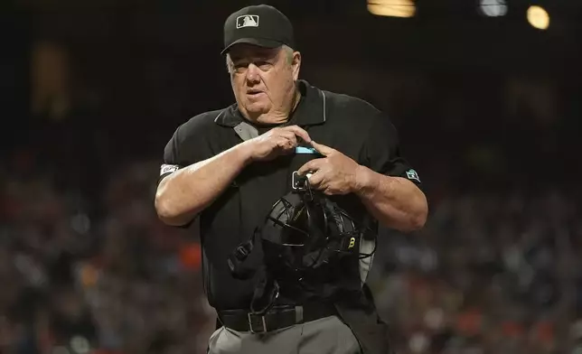 FILE - Umpire Joe West during a baseball game between the San Francisco Giants and the San Diego Padres in San Francisco, Oct. 1, 2021. (AP Photo/Jeff Chiu, File)