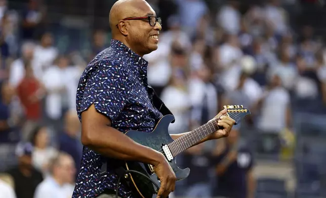 FILE - Former New York Yankees' Bernie Williams performs the national anthem before a baseball game against the Detroit Tigers, Sept. 5, 2023, in New York. (AP Photo/Adam Hunger, File)