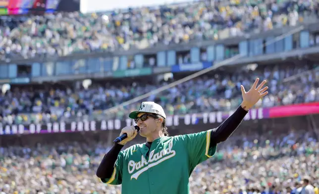 FILE - Former Oakland Athetics pitcher Barry Zito sings the national anthem before the Athletics play the Texas Rangers in Oakland, Calif., Sept. 26, 2024. (Carlos Avila Gonzalez/San Francisco Chronicle via AP, File)