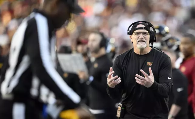 Washington Commanders head coach Dan Quinn argues a call in the first half of an NFL football game against the Chicago Bears Sunday, Oct. 27, 2024, in Landover, Md. (AP Photo/Nick Wass)