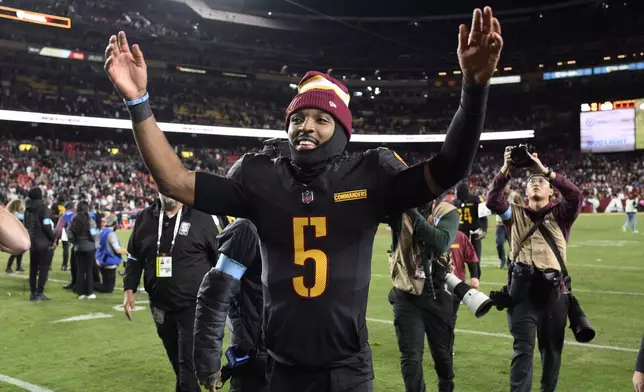 Washington Commanders quarterback Jayden Daniels (5) leaves the field after an 18-15 win over the Chicago Bears in an NFL football game Sunday, Oct. 27, 2024, in Landover, Md. (AP Photo/Nick Wass)