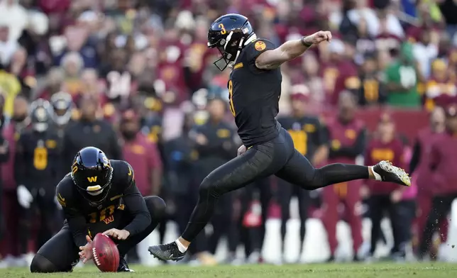 Washington Commanders place kicker Austin Seibert (3) kicks a 28-yard field goal against the Chicago Bears in the first half of an NFL football game Sunday, Oct. 27, 2024, in Landover, Md. (AP Photo/Stephanie Scarbrough)