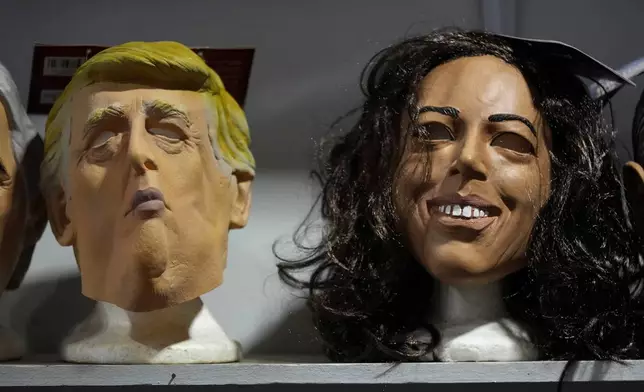 Masks of Republican presidential nominee former President Donald Trump and Democratic presidential nominee Vice President Kamala Harris are seen on display at The Theatrical Shop, Tuesday, Oct. 29, 2024, in West Des Moines, Iowa. (AP Photo/Charlie Neibergall)