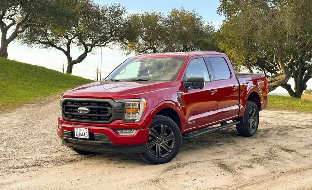 This photo provided by Edmunds shows a 2021 F-150. Equipped with the hybrid engine, the F-150 gets up to an EPA-estimated 25 mpg combined. (Courtesy of Edmunds via AP)