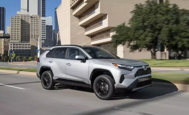 This photo provided by Toyota shows a 2022 RAV4 Hybrid. The EPA estimates it gets up to 40 mpg in combined city/highway driving. (Courtesy of Toyota Motor Sales U.S.A. via AP)