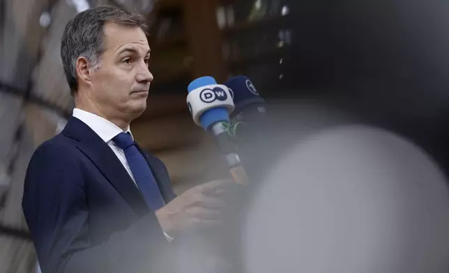 Belgium's Prime Minister Alexander De Croo speaks with the media as he arrives for an EU-Gulf Cooperation Council meeting at the European Council building in Brussels, Belgium, Wednesday, Oct. 16, 2024. (AP Photo/Omar Havana)