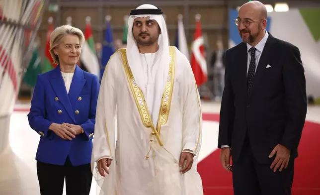 European Council President Charles Michel, right, and European Commission President Ursula von der Leyen, left, welcome United Arab Emirates Deputy Prime Minister Sheikh Maktoum Bin Mohammed Bin Rashid Al Maktoum during an EU-Gulf Cooperation Council meeting at the European Council building in Brussels, Belgium, Wednesday, Oct. 16, 2024. (Johanna Geron, Pool Photo via AP)