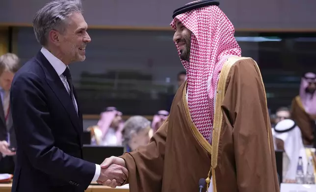 Saudi Arabia's Prime Minister and Crown Prince Mohammed bin Salman, right, shakes hands with Netherland's Prime Minister Dick Schoof during an EU-Gulf Cooperation Council roundtable meeting at the European Council building in Brussels, Belgium, Wednesday, Oct. 16, 2024. (AP Photo/Virginia Mayo)