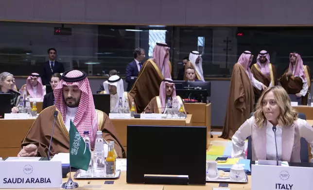 Saudi Arabia's Prime Minister and Crown Prince Mohammed bin Salman, left, and Italy's Prime Minister Giorgia Meloni attend an EU-Gulf Cooperation Council roundtable meeting at the European Council building in Brussels, Belgium, Wednesday, Oct. 16, 2024. (AP Photo/Virginia Mayo)