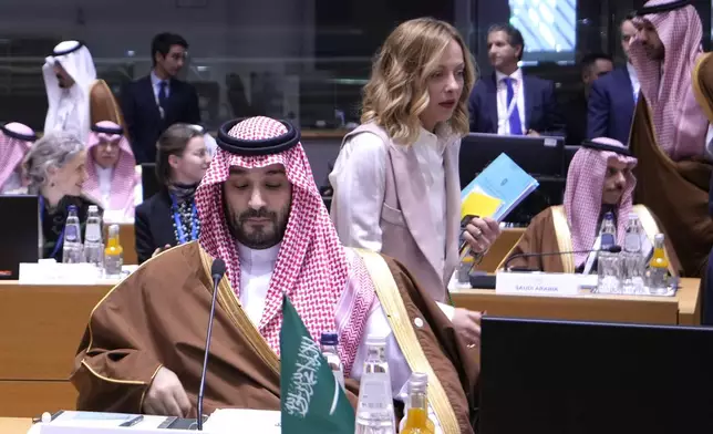 Saudi Arabia's Prime Minister and Crown Prince Mohammed bin Salman bin Abdulaziz Al Saud, center, and and Italy's Prime Minister Giorgia Meloni, center right, attend an EU-Gulf Cooperation Council roundtable meeting at the European Council building in Brussels, Belgium, Wednesday, Oct. 16, 2024. (AP Photo/Virginia Mayo)