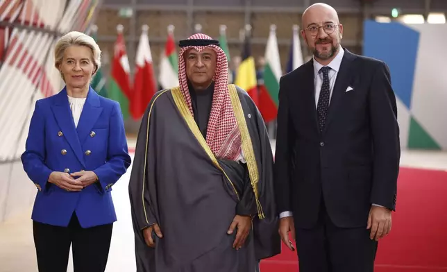 European Council President Charles Michel, right, and European Commission President Ursula von der Leyen, left, welcome Secretary General of the Gulf Cooperative Council Jasem Mohamed Albudaiwi during an EU-Gulf Cooperation Council meeting at the European Council building in Brussels, Belgium, Wednesday, Oct. 16, 2024. (Johanna Geron, Pool Photo via AP)