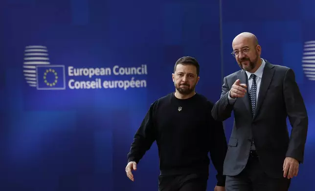 Ukraine's President Volodymyr Zelenskyy, left, and European Council President Charles Michel arrive to an EU summit in Brussels, Thursday, Oct. 17, 2024. (AP Photo/Geert Vanden Wijngaert)