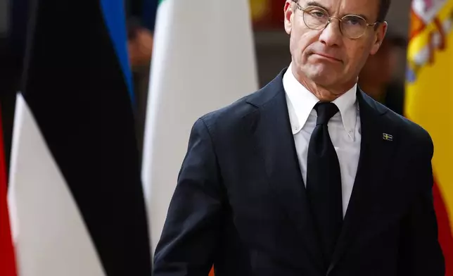 Sweden's Prime Minister Ulf Kristersson arrives to an EU summit in Brussels, Thursday, Oct. 17, 2024. (AP Photo/Geert Vanden Wijngaert)