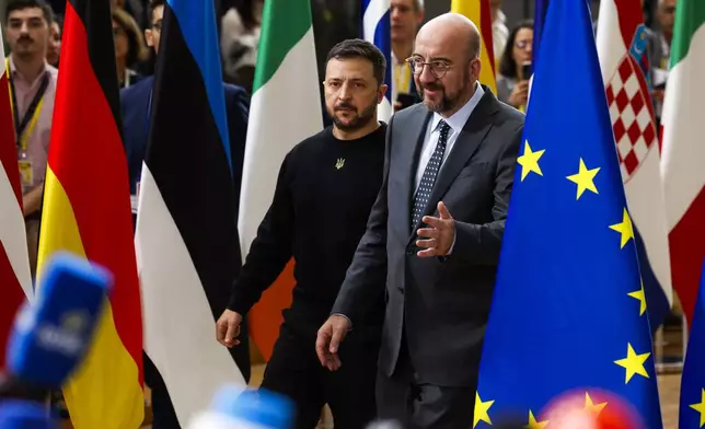 Ukraine's President Volodymyr Zelenskyy, left, and European Council President Charles Michel arrive to an EU summit in Brussels, Thursday, Oct. 17, 2024. (AP Photo/Geert Vanden Wijngaert)