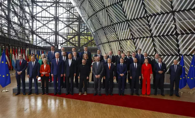 European Union leaders pose for a group photo with Ukraine's President Volodymyr Zelenskyy, front row sixth left, during an EU summit in Brussels, Thursday, Oct. 17, 2024. (AP Photo/Geert Vanden Wijngaert)