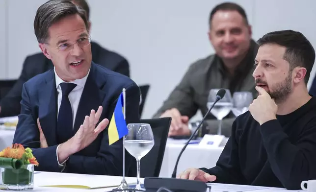 NATO Secretary General Mark Rutte, left, speaks with Ukraine's President Volodymyr Zelenskyy during the NATO-Ukraine Council working dinner at NATO Headquarters in Brussels, Thursday, Oct. 17, 2024. (Olivier Matthys, Pool Photo via AP)