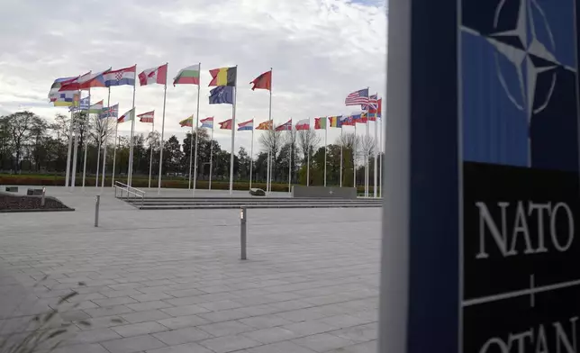 A view of flags of NATO member countries, outside NATO headquarters in Brussels on Monday, Oct. 28, 2024. (AP Photo/Virginia Mayo)