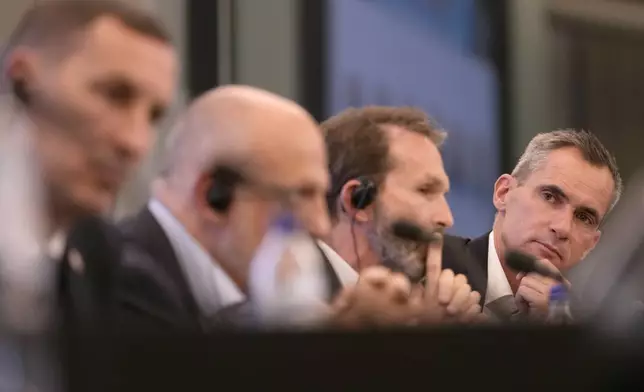 Panel members, from left to right, FIFPRO Europe president David Terrier, LaLiga president Javier Tebas, AIC resident Umberto Calcagno and Pro League CEO Lorin Parys participate in a media conference on protecting player health and safeguarding the sustainability of national leagues at the Residence Palace in Brussels, on Monday, Oct. 14, Oct. 8, 2024. (AP Photo/Virginia Mayo)