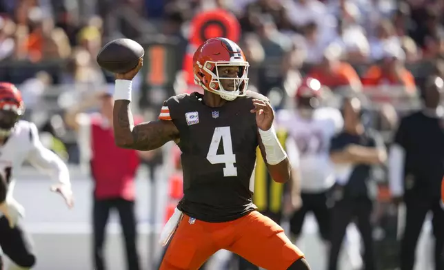 Cleveland Browns quarterback Deshaun Watson (4) passes in the first half of an NFL football game against the Cincinnati Bengals, Sunday, Oct. 20, 2024, in Cleveland. (AP Photo/Sue Ogrocki)