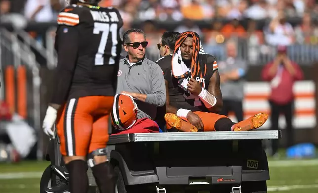 Cleveland Browns quarterback Deshaun Watson (4) is carted off the field after being injured in the first half of an NFL football game against the Cincinnati Bengals, Sunday, Oct. 20, 2024, in Cleveland. (AP Photo/David Richard)