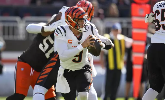 Cincinnati Bengals quarterback Joe Burrow (9) scrambles in the first half of an NFL football game against the Cleveland Browns, Sunday, Oct. 20, 2024, in Cleveland. (AP Photo/Sue Ogrocki)