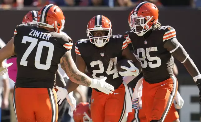 Cleveland Browns running back Nick Chubb (24) celebrates his touchdown in the first half of an NFL football game against the Cincinnati Bengals, Sunday, Oct. 20, 2024, in Cleveland. (AP Photo/Sue Ogrocki)