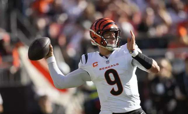 Cincinnati Bengals quarterback Joe Burrow (9) drops back to pass in the second half of an NFL football game against the Cleveland Browns, Sunday, Oct. 20, 2024, in Cleveland. (AP Photo/Sue Ogrocki)