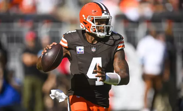 Cleveland Browns quarterback Deshaun Watson (4) scrambles in the first half of an NFL football game against the Cincinnati Bengals, Sunday, Oct. 20, 2024, in Cleveland. (AP Photo/David Richard)